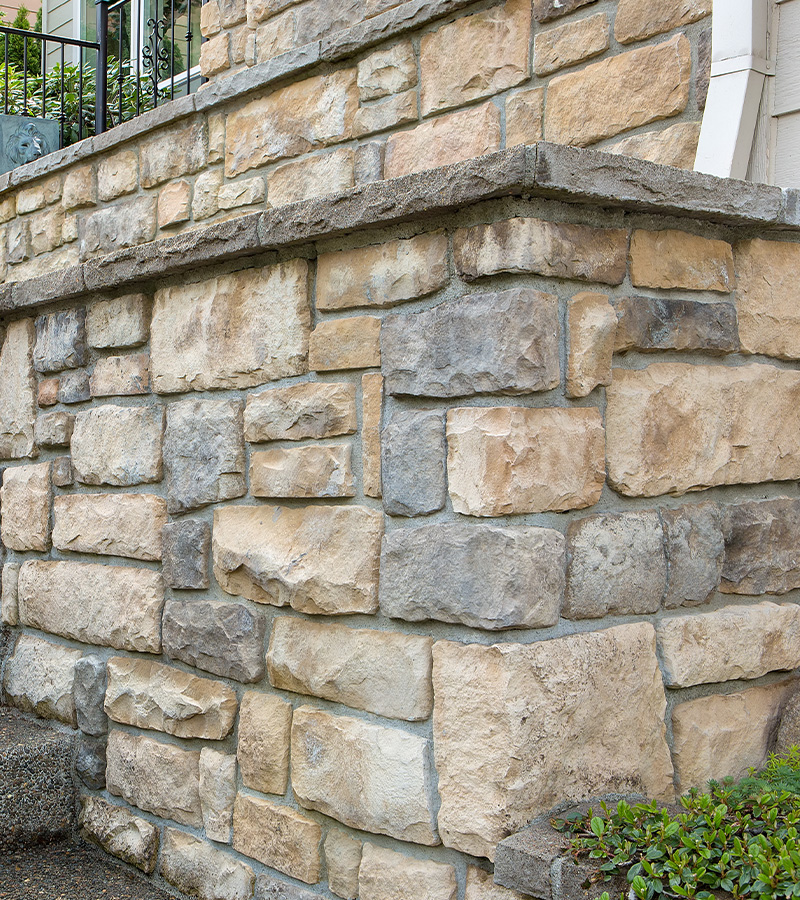 blue construction blocks stacked with one block above representing a 16 step process in building