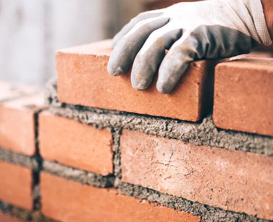 Alturn Limited logo featuring bricklaying contractors emphasizing quality work and 14 years of experience